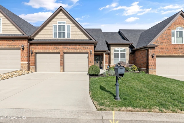view of front facade featuring brick siding, a front lawn, driveway, and a shingled roof