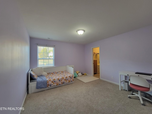 carpeted bedroom with baseboards