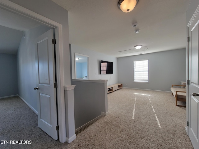 hall with baseboards and carpet floors