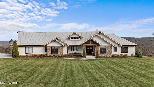 950 White Wing Rd, Lenoir City, TN 37771 - view of front facade featuring stone siding, metal roof, and a front lawn