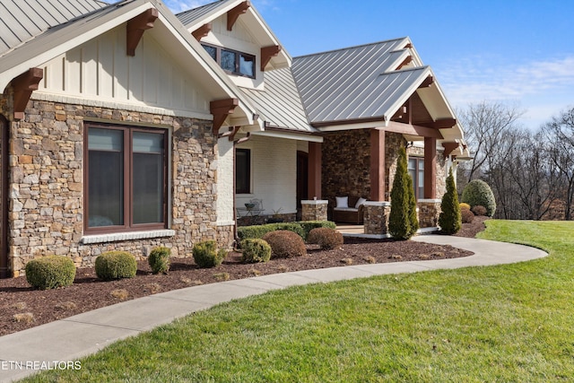 950 White Wing Rd, Lenoir City, TN 37771 - view of front of house with a front lawn, metal roof, stone siding, and board and batten siding