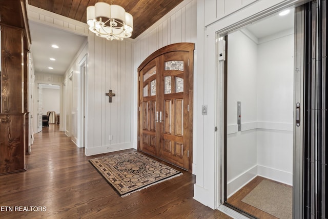 950 White Wing Rd, Lenoir City, TN 37771 - entrance foyer with elevator, baseboards, an inviting chandelier, and dark wood finished floors