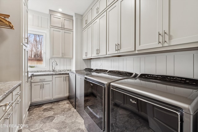 950 White Wing Rd, Lenoir City, TN 37771 - laundry area featuring stone finish floor, recessed lighting, a sink, cabinet space, and separate washer and dryer