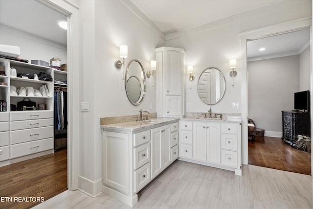 950 White Wing Rd, Lenoir City, TN 37771 - full bathroom with a spacious closet, vanity, baseboards, and wood finished floors