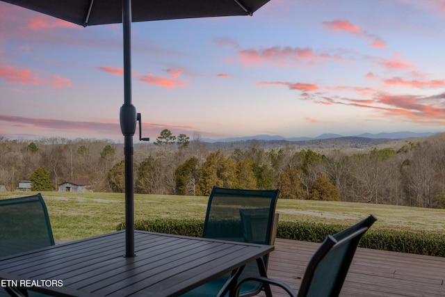 950 White Wing Rd, Lenoir City, TN 37771 - deck at dusk with a lawn and a view of trees