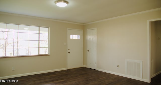 entryway featuring crown molding, baseboards, visible vents, and dark wood-style flooring