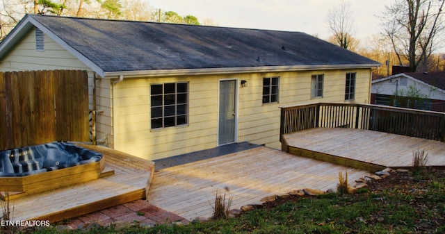 wooden terrace with fence and hot tub deck surround