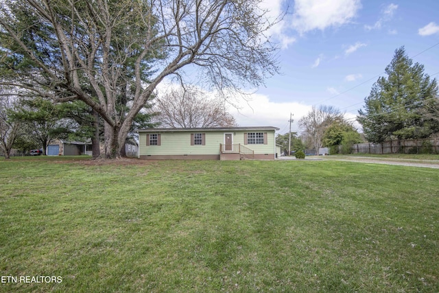 view of front of property with a front yard and crawl space