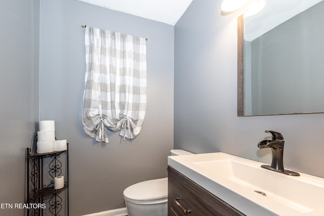 half bath with toilet and vanity