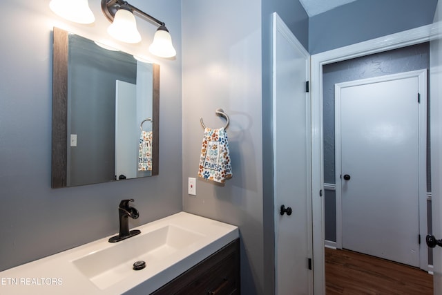 bathroom featuring vanity and wood finished floors