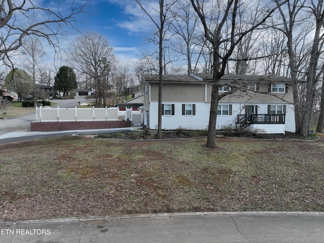 view of front of house with fence