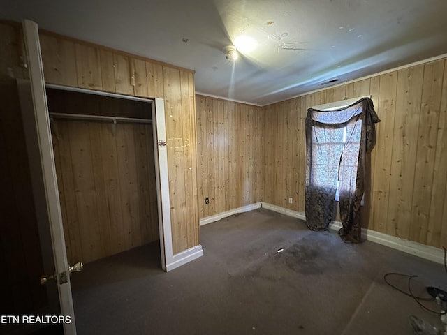 921 Winchester Ave, Middlesboro, KY 40965 - unfurnished bedroom featuring wooden walls, visible vents, and baseboards