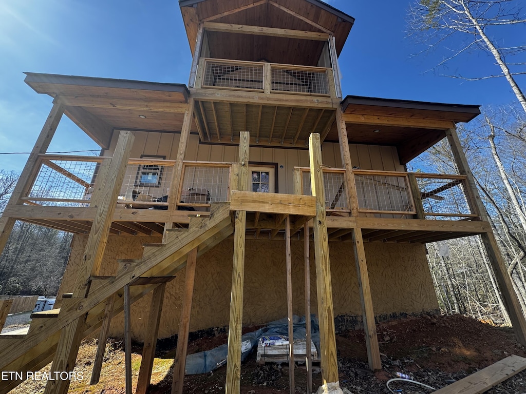 back of property featuring board and batten siding