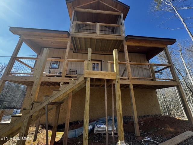 back of property featuring board and batten siding