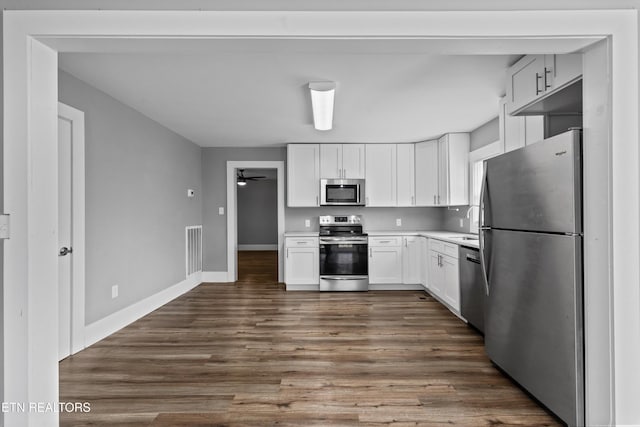 kitchen with visible vents, ceiling fan, light countertops, appliances with stainless steel finishes, and white cabinetry