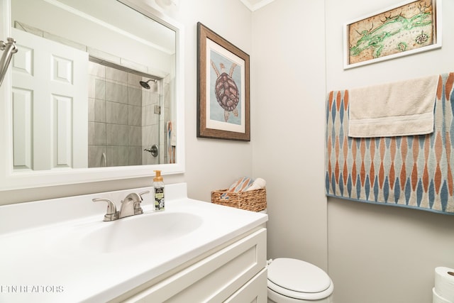 full bath with a tile shower, toilet, and vanity
