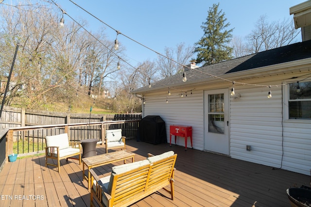 wooden terrace with grilling area and fence