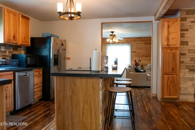 4662 Baker Hwy, Huntsville, TN 37756 - kitchen with dark countertops, dark wood-style flooring, black microwave, and stainless steel dishwasher