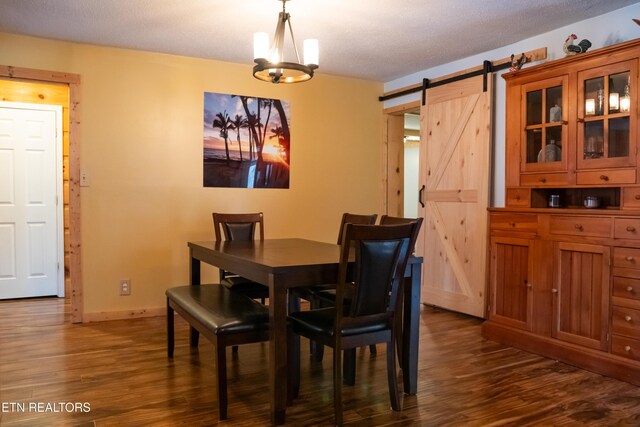 4662 Baker Hwy, Huntsville, TN 37756 - dining area with a chandelier, baseboards, dark wood-type flooring, and a barn door