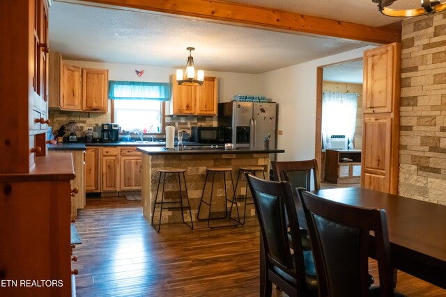 4662 Baker Hwy, Huntsville, TN 37756 - kitchen featuring dark countertops, a notable chandelier, stainless steel fridge with ice dispenser, and black microwave