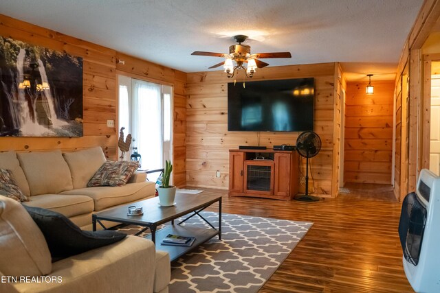 4662 Baker Hwy, Huntsville, TN 37756 - living area with heating unit, wooden walls, ceiling fan, and wood finished floors
