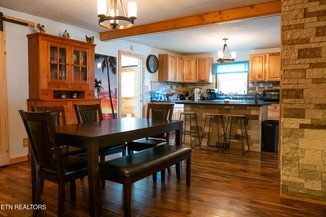 4662 Baker Hwy, Huntsville, TN 37756 - dining area with an inviting chandelier, dark wood-type flooring, and beam ceiling