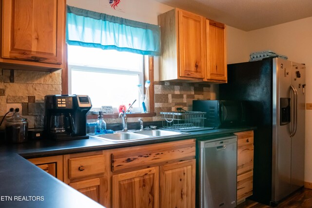 4662 Baker Hwy, Huntsville, TN 37756 - kitchen with dark countertops, appliances with stainless steel finishes, tasteful backsplash, and a sink