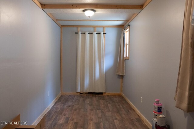 4662 Baker Hwy, Huntsville, TN 37756 - unfurnished room featuring beam ceiling, baseboards, and dark wood-style flooring