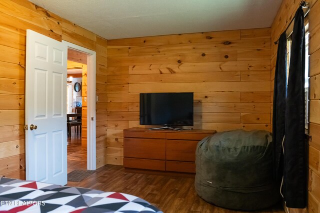 4662 Baker Hwy, Huntsville, TN 37756 - bedroom with wooden walls and dark wood-style floors