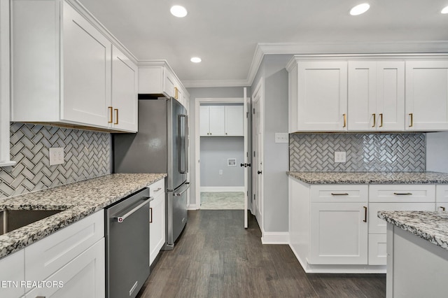 kitchen featuring stainless steel appliances, dark wood-style floors, white cabinets, and ornamental molding