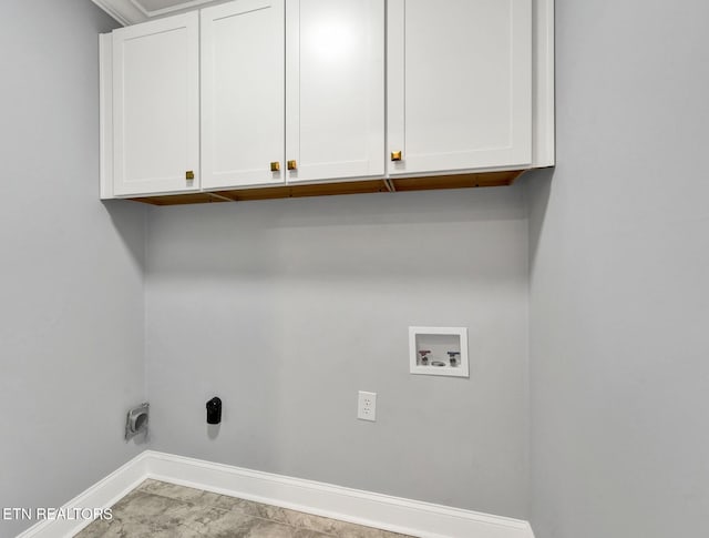 washroom featuring baseboards, cabinet space, hookup for an electric dryer, and washer hookup