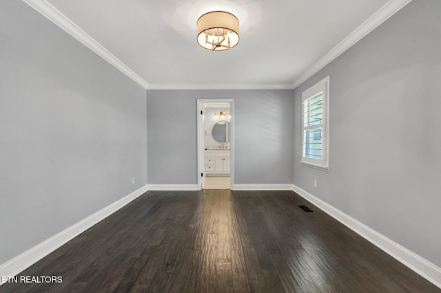 empty room featuring visible vents, baseboards, dark wood-style flooring, crown molding, and a notable chandelier