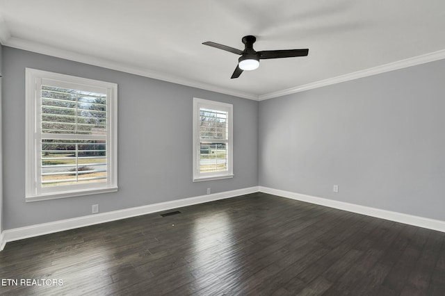unfurnished room featuring visible vents, baseboards, dark wood-style flooring, and crown molding