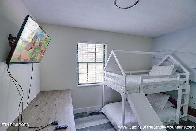 2218 Red Bank Cir, Sevierville, TN 37862 - unfurnished bedroom featuring wood finished floors and baseboards