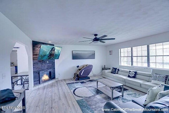 2218 Red Bank Cir, Sevierville, TN 37862 - living area with a large fireplace, wood finished floors, and ceiling fan