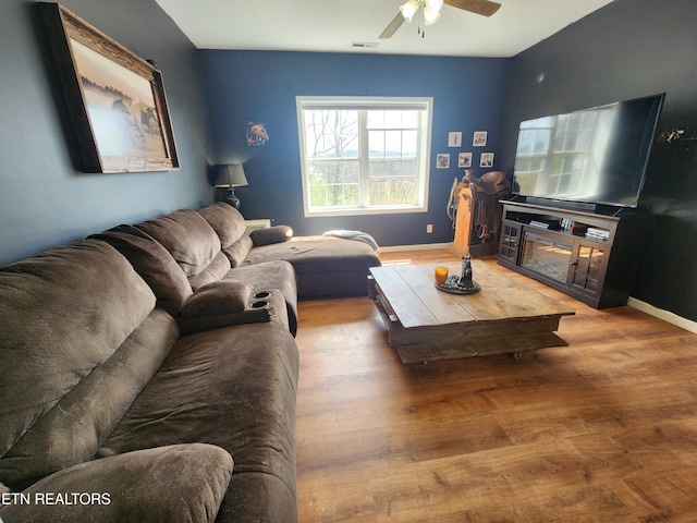 21876 E Coast Tellico Pkwy, Greenback, TN 37742 - living room with wood finished floors, a ceiling fan, visible vents, and baseboards