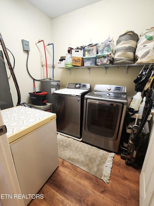 21876 E Coast Tellico Pkwy, Greenback, TN 37742 - clothes washing area featuring wood finished floors, washing machine and dryer, and laundry area