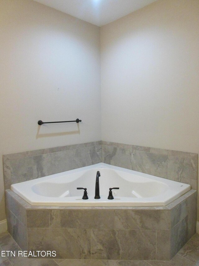 full bath with a garden tub
