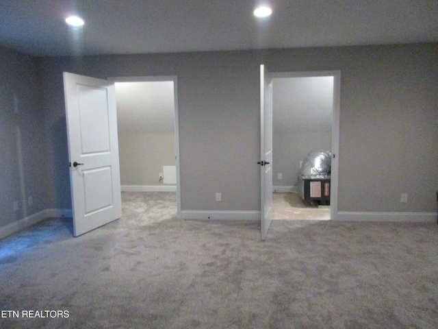 interior space with baseboards, recessed lighting, and carpet