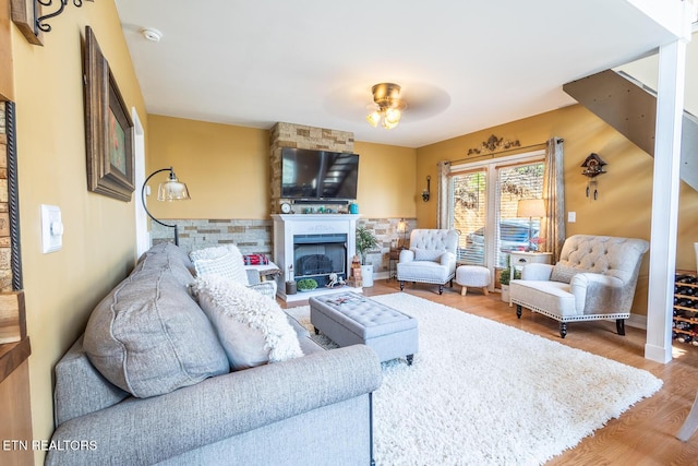 1027 N Highland Dr, Gatlinburg, TN 37738 - living area with a large fireplace, wood finished floors, and a ceiling fan