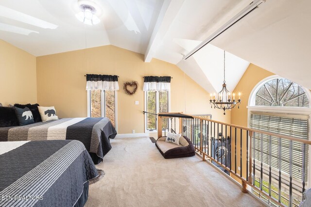 1027 N Highland Dr, Gatlinburg, TN 37738 - carpeted bedroom featuring vaulted ceiling with beams and a chandelier
