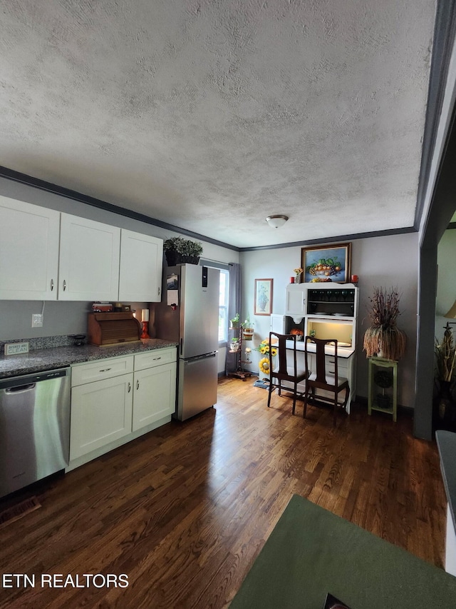 3009 Sanders Dr, Knoxville, TN 37918 - kitchen featuring white cabinetry, a textured ceiling, appliances with stainless steel finishes, and dark wood-type flooring