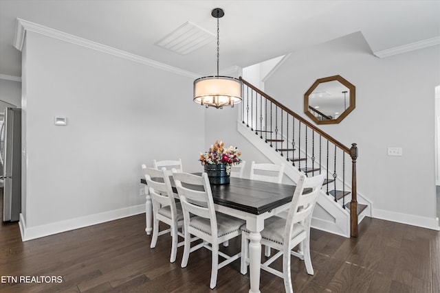 dining room featuring stairway, a notable chandelier, ornamental molding, and dark wood finished floors