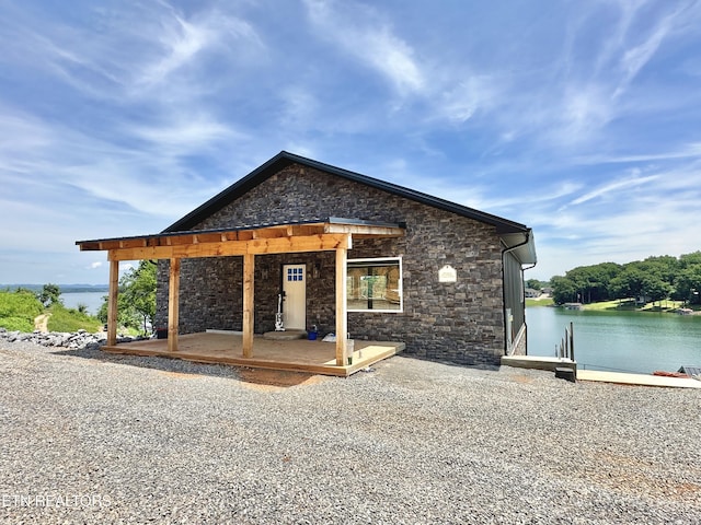 179 Lakeshore Bay Dr, Jefferson City, TN 37760 - view of front of property with stone siding, a pergola, and a water view