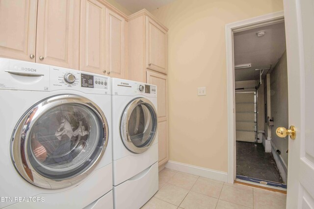 107 Sunny St, Sharps Chapel, TN 37866 - washroom featuring washing machine and clothes dryer, light tile patterned floors, baseboards, and cabinet space