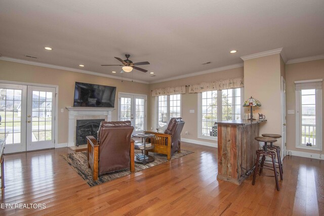 107 Sunny St, Sharps Chapel, TN 37866 - living area featuring healthy amount of natural light, wood finished floors, recessed lighting, and ornamental molding