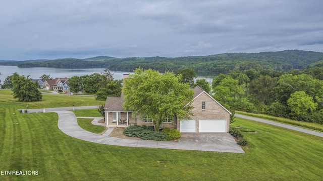 107 Sunny St, Sharps Chapel, TN 37866 - view of front of house featuring a water view, a wooded view, and concrete driveway
