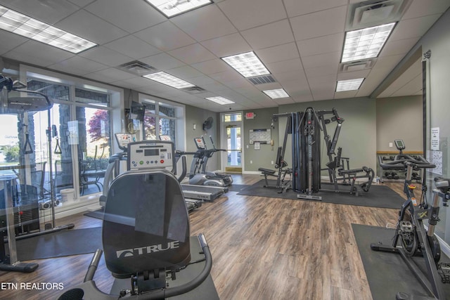 107 Sunny St, Sharps Chapel, TN 37866 - workout area with wood finished floors, a paneled ceiling, and baseboards