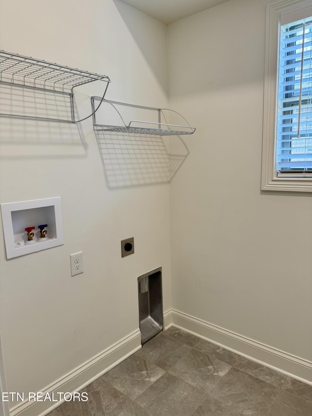 clothes washing area with baseboards, hookup for an electric dryer, washer hookup, and laundry area