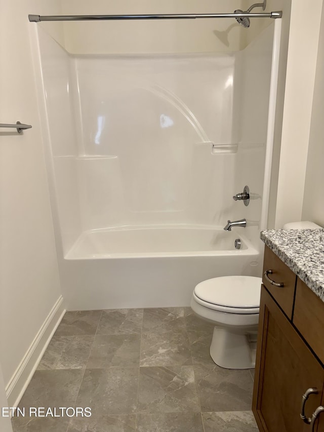 full bath featuring baseboards, shower / bathing tub combination, toilet, and vanity